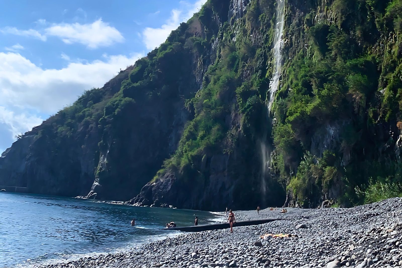 Praia dos Anjos pebble beach below cliffs at Ponta do Sol Madeira