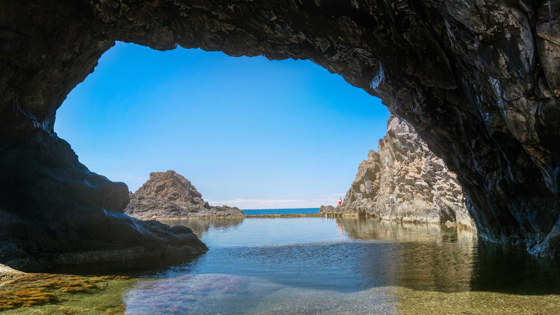 Poças das Lesmas natural lava pools Seixal north coast Madeira with basalt cliffs